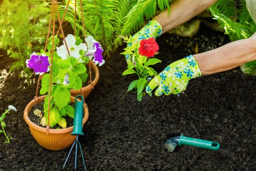 Gardener preparing tools at the start of a garden job